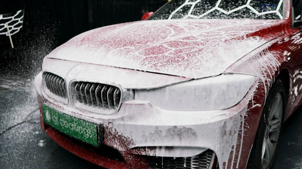 Car being covered in prewash foamy shampoo, ecoclean blizzard to wash out any grime