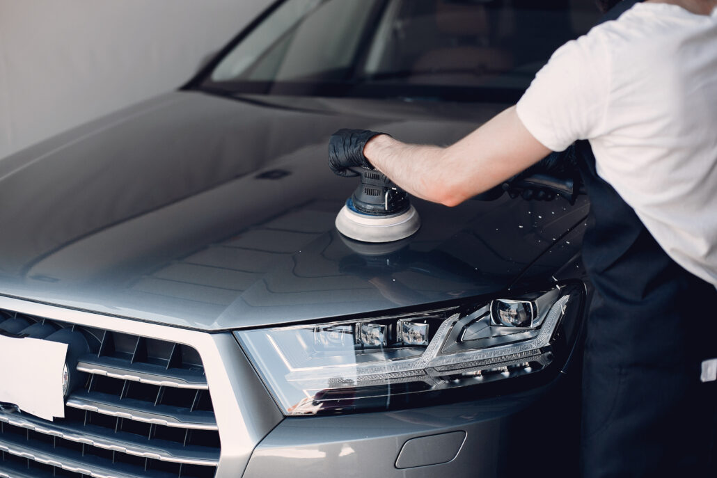 Man polishing and keeping the car looking shiny and flawless